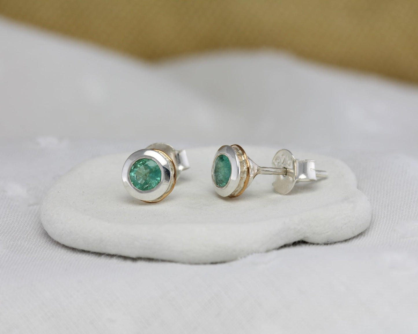 Sterling Silver Emerald Stud Earrings With 14 carat Gold Detail