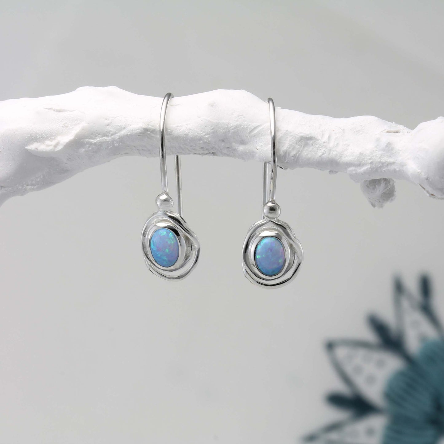 Sterling Silver Handmade Dainty Opalite Hook Earrings on a white branch