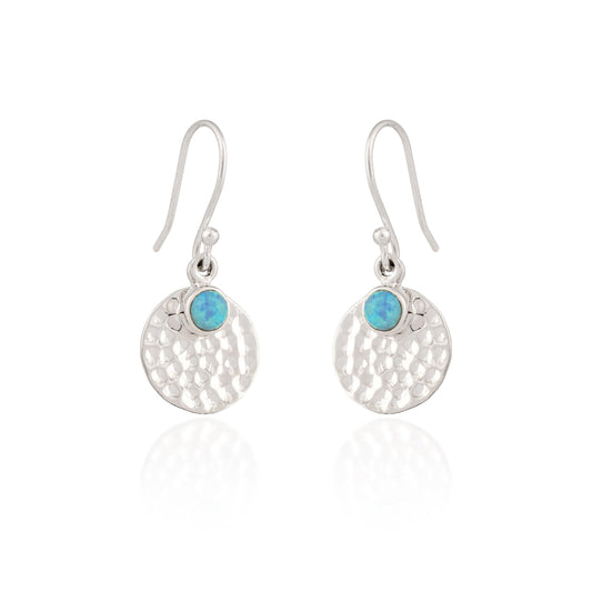 Silver earrings with turquoise stones on a white background