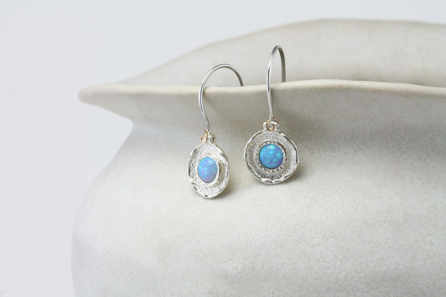 Sterling Silver Blue Opalite Hook Earrings on a white ceramic dish
