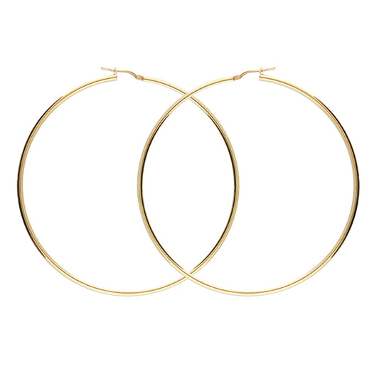 Gold hoop earrings on a white background