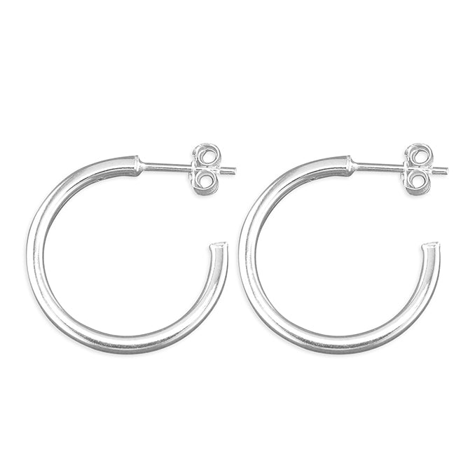 Silver hoop earrings on a white background